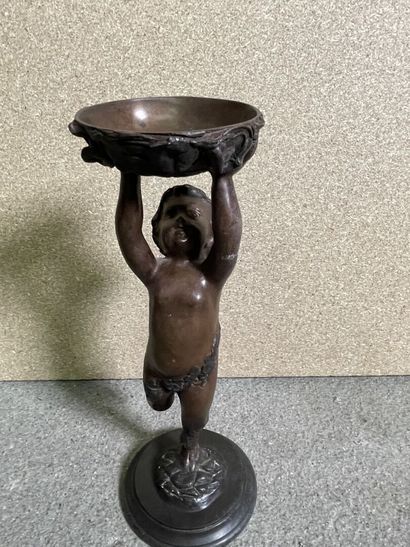 null Two bronzes : 

-Faun supporting a cup

33 cm

-Child's hand

16 cm