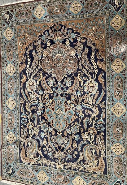 Three woolen carpets :

one with a blue background...