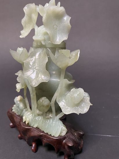 null Green nephrite covered vase carved with water lilies. 

China, 20th century.

H...