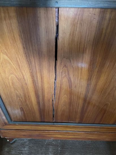 null Rosewood veneer display cabinet, opening with two semi-glazed doors.

Louis...