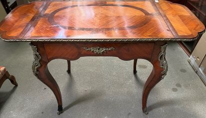 null Writing table in rosewood veneer, the top with two small flaps and a drawer...