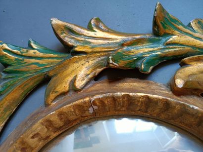 null Pair of gilded wood mirrors with vegetal decoration. 

H: 70cm; W: 49cm 

Accidents,...