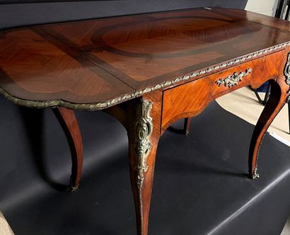 null Writing table in rosewood veneer, the top with two small flaps and a drawer...