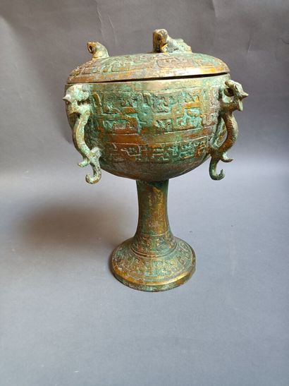Covered cup with four handles in oxidized...