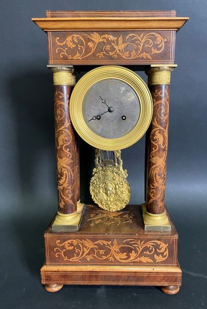 null Portico clock in rosewood and marquetry of arabesques of leaves and birds.

Charles...