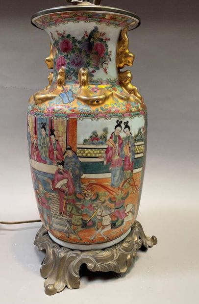 A Canton porcelain baluster vase with polychrome...
