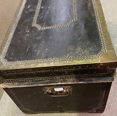 null Travel trunk entirely covered with leather with carved and studded friezes,...