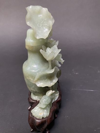 null Green nephrite covered vase carved with water lilies. 

China, 20th century.

H...
