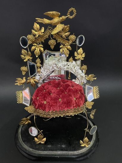 null Bridal crown on its gilded metal display under glass globe, blackened wood base.

19th...