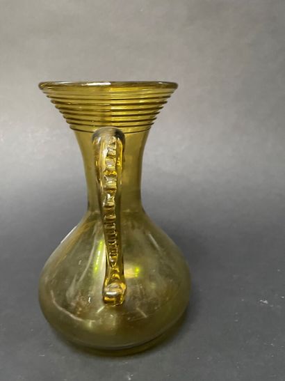 null Yellow glass baluster vase with two handles decorated with waves. 

Italy, 19th...