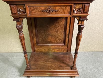 null Cabinet in patinated walnut opening to two drawers and a leaf carved with vase...