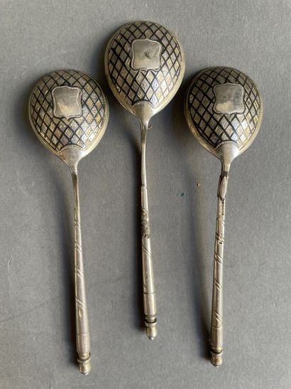 Three silver spoons with diamond-shaped decoration...