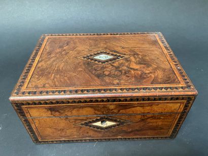null Walnut veneer case inlaid with a geometric frieze centered on a rhombus and...