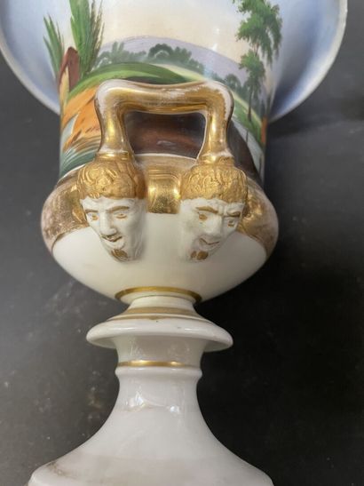 null Pair of porcelain vases and tea pot decorated with landscapes and gallant scenes.

Circa...