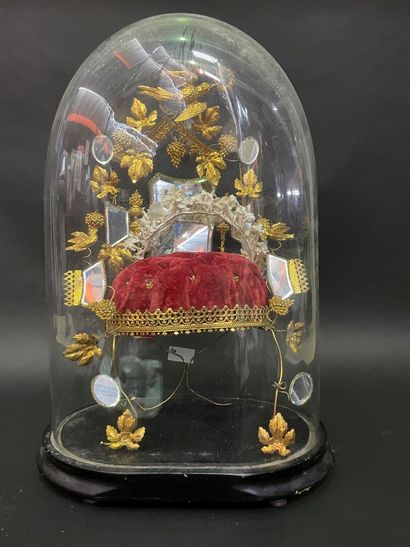 Bridal crown on its gilded metal display...