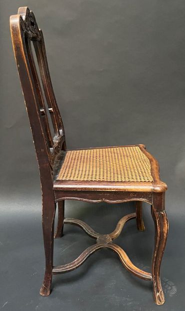 null Suite of ten chairs with caned seats in molded natural wood, with leafy shoulders,...
