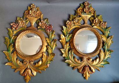 null Pair of gilded wood mirrors with vegetal decoration. 

H: 70cm; W: 49cm 

Accidents,...