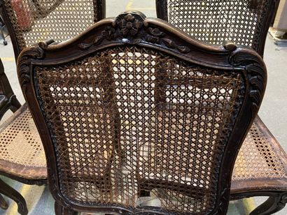 null Eight caned chairs in natural wood with leafy sides.

Louis XV style.

(2 of...