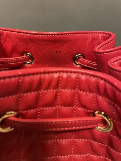 null CELINE
Quilted backpack in red leather, small model, closure by link making...
