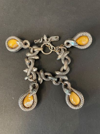 null Workshop of the 1990's
Metal bracelet with snake motifs holding four pendants.
Not...