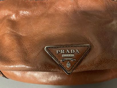 null PRADA
27 cm bag in camel leather and black patent leather, turn button closure...