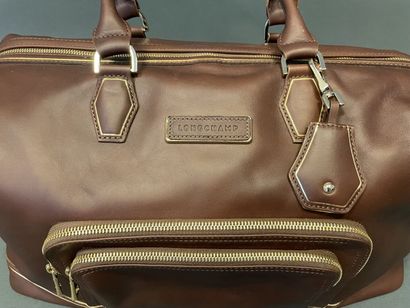 null LONGCHAMP
Bag " Legende " in brown leather with double handles, double zipper,...
