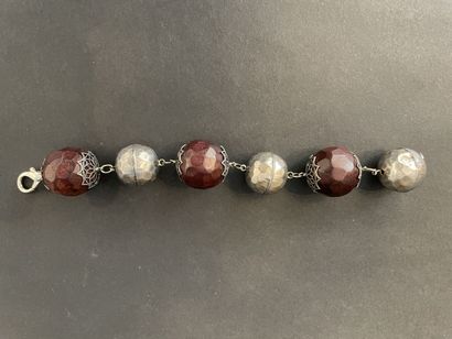 null Workshop of the Years 1990
Articulated bracelet of wooden ball and hammered...