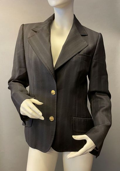 null DOLCE & GABBANA, ARMANI COLLEZIONI
Lot including a black striped cotton jacket,...