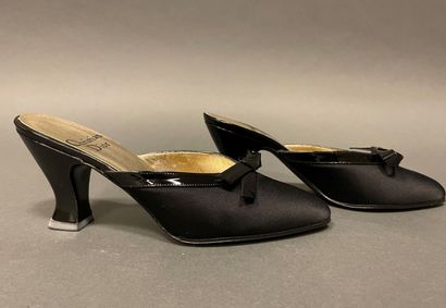 null Christian DIOR
Pair of black satin mules embellished with a black patent leather...