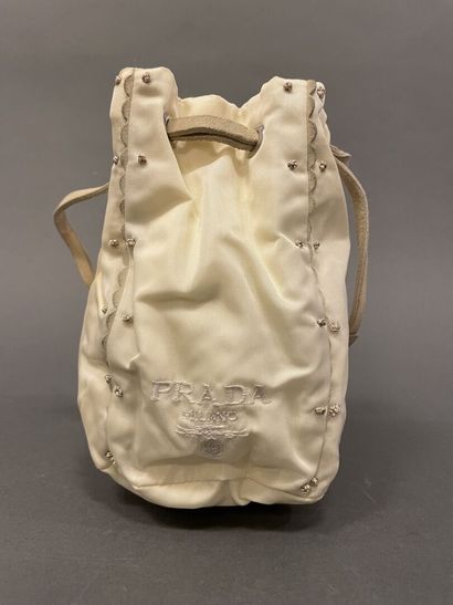 PRADA 
White nylon purse enhanced with scalloped...