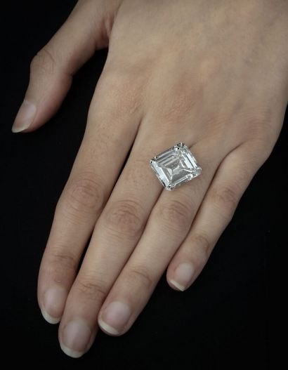 null Ring decorated with an emerald cut diamond mounted in solitaire.
White gold...