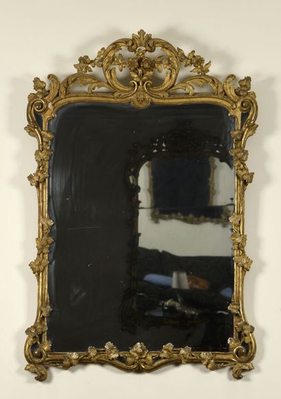 Mirror (with mercury) in a carved and gilded...