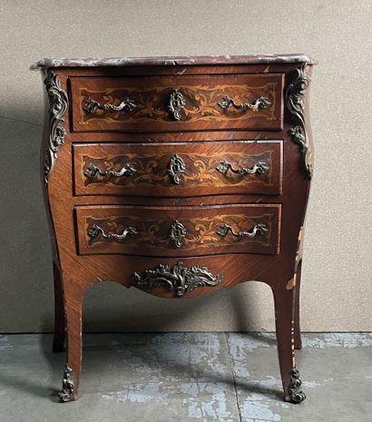 null Rosewood veneered chest of drawers with three drawers and curved front. 
Louis...