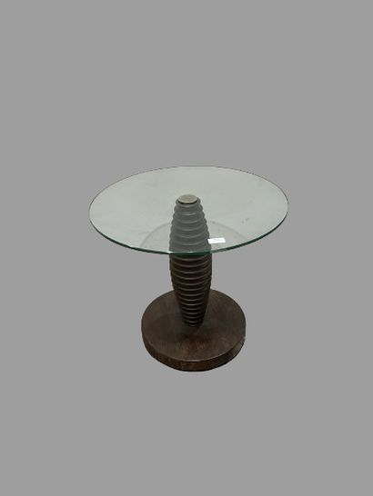 null Coffee table with mahogany base and round glass top.
Contemporary work. 
52...