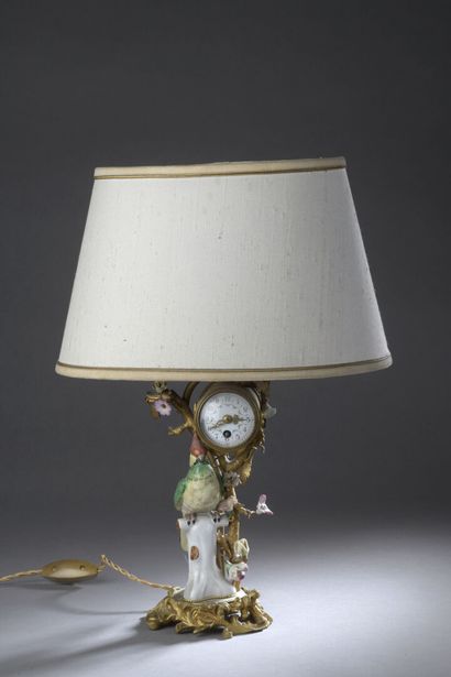 null Lamp base with a Saxony porcelain bird, a gilt bronze branch with porcelain...