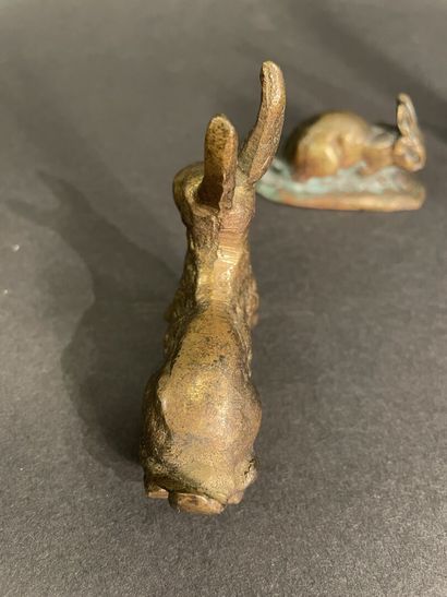 null Lot comprising two hares and two rabbits in patinated bronze, one in the taste...