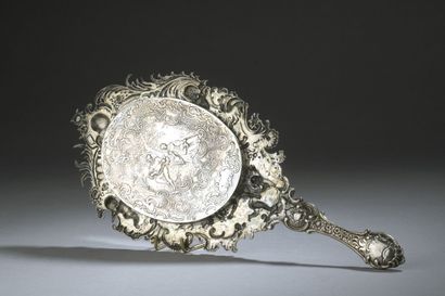 null Silver hand mirror with putti decoration.
Rocaille style.
Gross weight: 308...