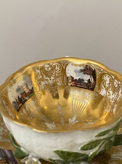 null MEISSEN
Porcelain teacup and saucer with polychrome decoration of animated landscapes...