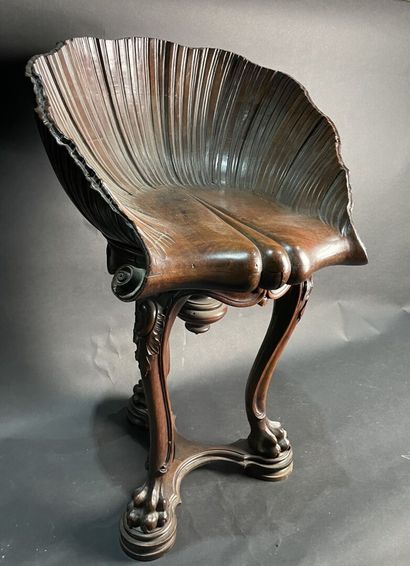 null Mahogany swivel stool, leaf-shaped seat, standing on three lion-shank legs....