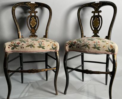 null Pair of black lacquered chairs, upholstered with a floral tapestry. 
Napoleon...