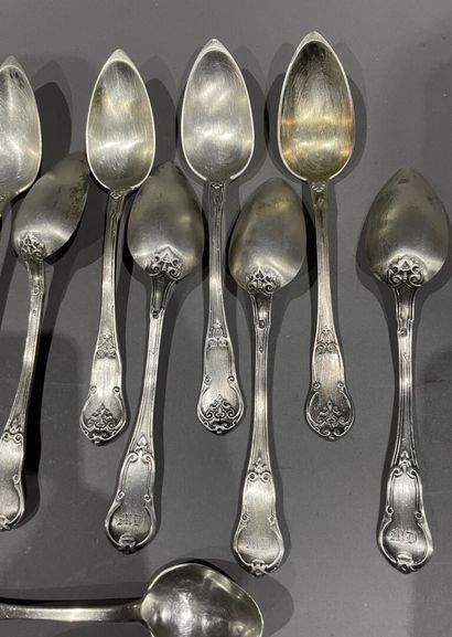 null Ten small silver spoons chased with an arabesque design and figured
In their...
