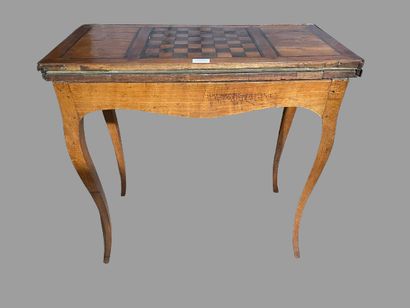 null Rectangular walnut veneered game table, the top inlaid with a checkerboard.
Provincial...