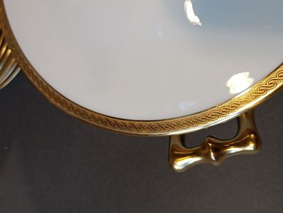 null Porcelain dinner service with gold filet, including a soup tureen, a sauceboat,...