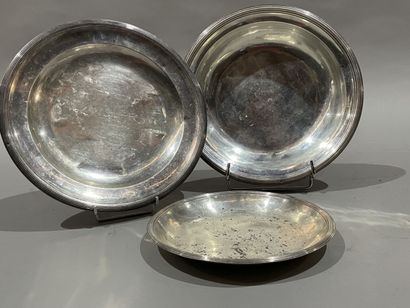 null A plate, a deep dish and a round silver bowl with filet. The bowl, early 19th...