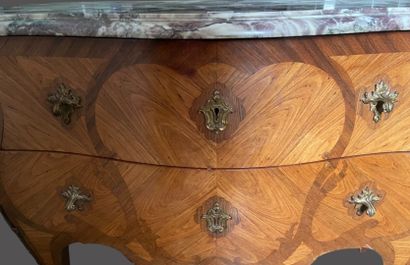 null Rosewood veneered chest of drawers with amaranth frames, curved front and sides,...