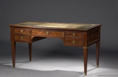 null Mahogany and mahogany veneer flat desk; rectangular in shape, it opens with...