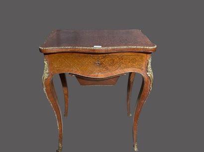 null Veneered work table inlaid with scrolls, opening to a flap and one drawer, curved...