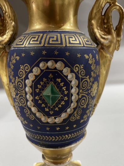 null Porcelain ovoid vase decorated with trompe l'oeil gems on a blue background...