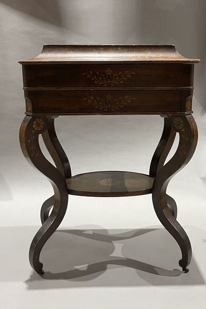 null Rosewood veneered work table with light wood inlays forming palmettes. 
Charles...