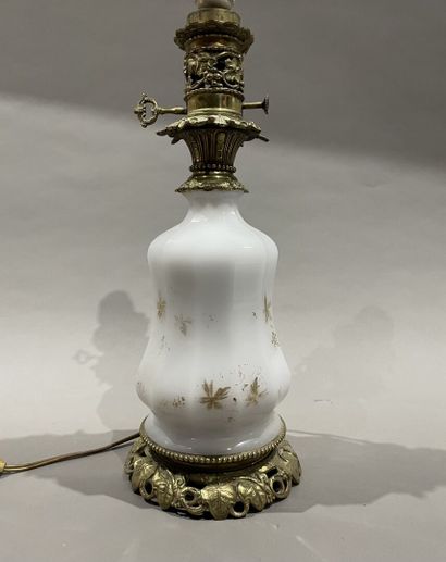 null Oil lamp base, opaline glass reservoir, gilt bronze frame with foliage decoration....